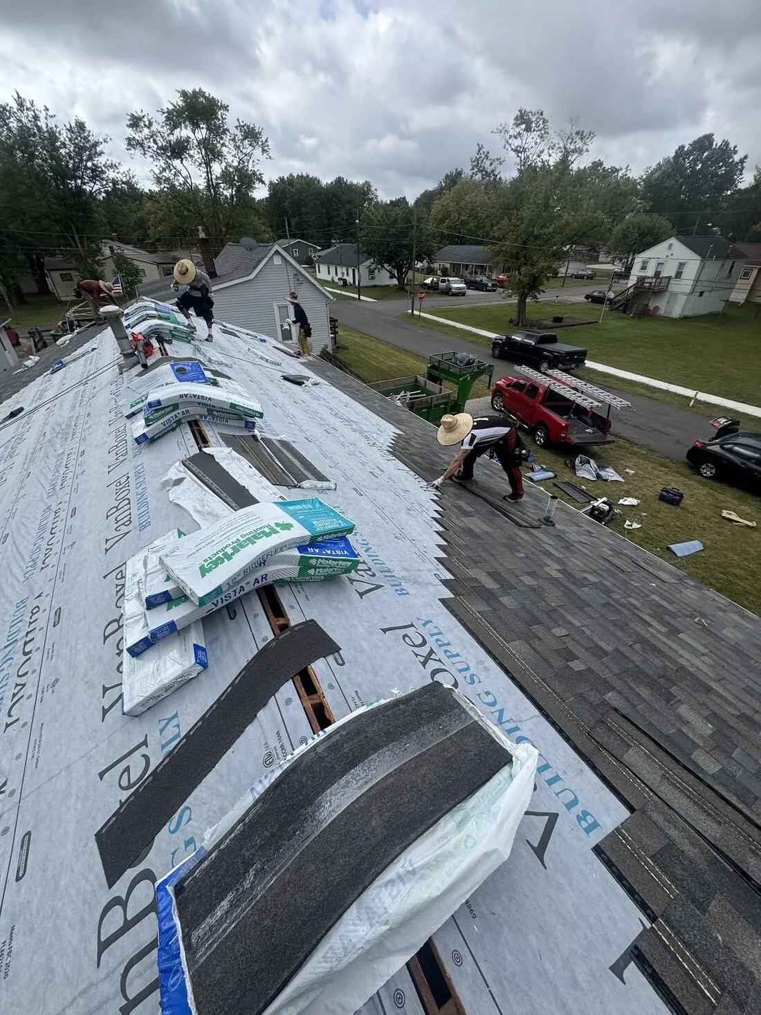 Crew installing Malarkey Vista shingles