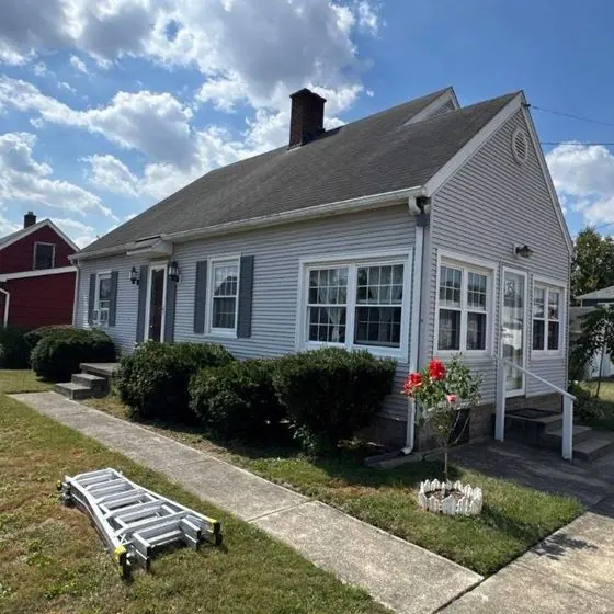 Before: Cape Cod: roof and siding